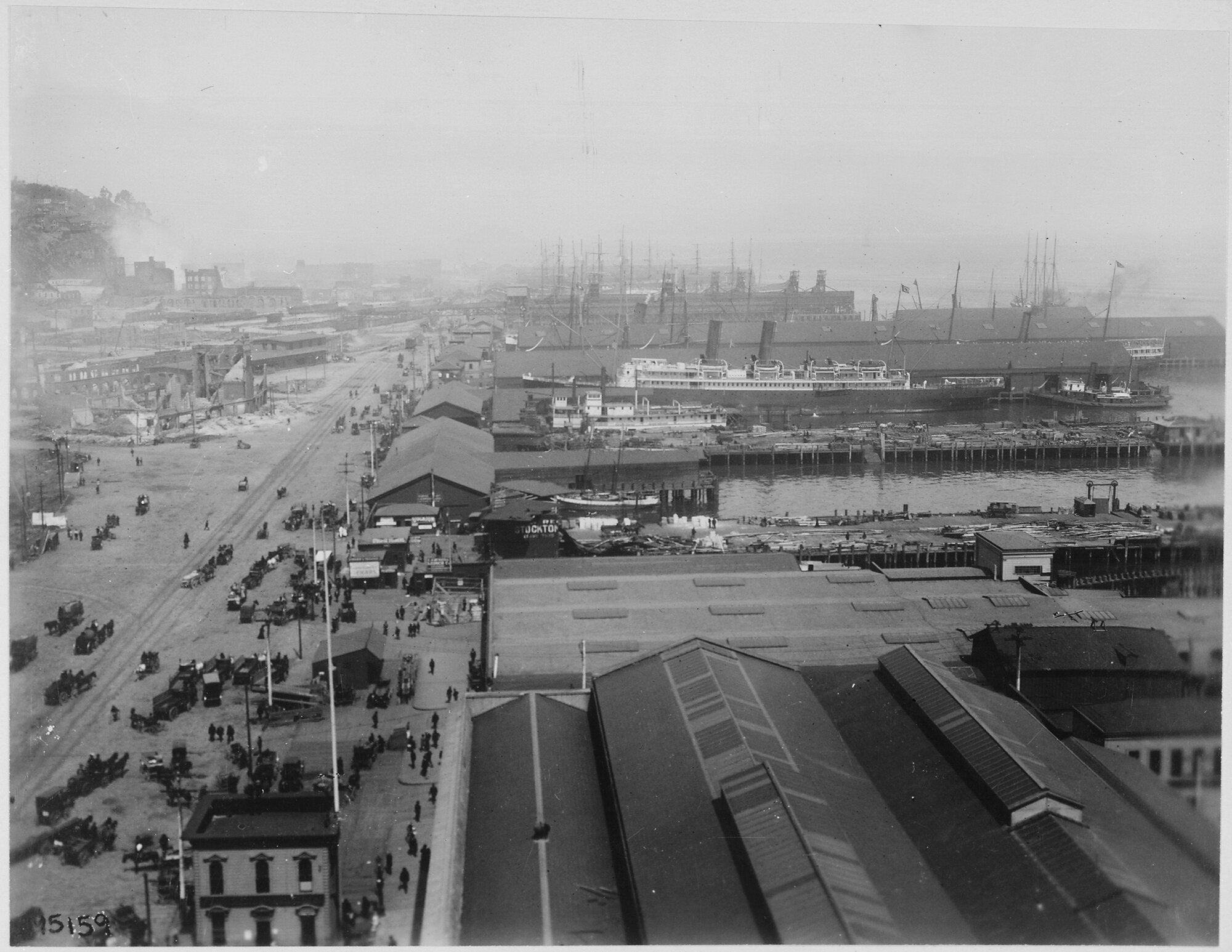 The San Francisco waterfront north of the Ferry Building, 1906, with piers and ships